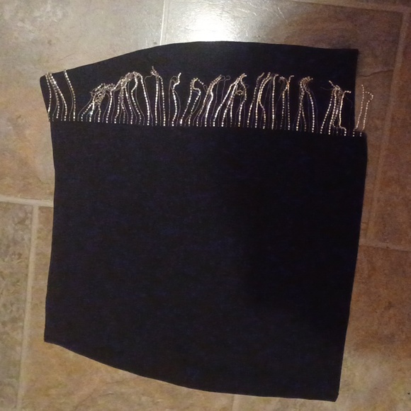 A black skirt with rhinestone fringe. - Picture 2 of 3